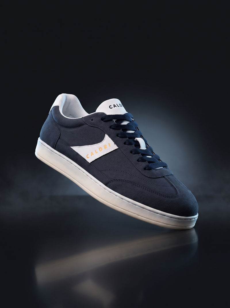Caldri Navy Blue Vegan Leather Casual Sneakers For Men - three quarter view