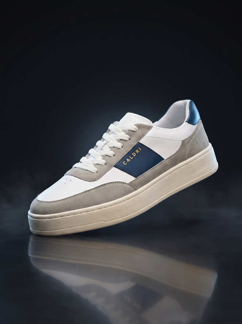 Caldri White Blue Vegan Leather Casual Sneakers For Men - three quarter view